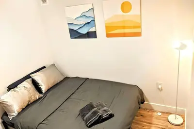 a bedroom with a bed in a room at 2 Bed Apartment Free Parking Central Location in Vancouver