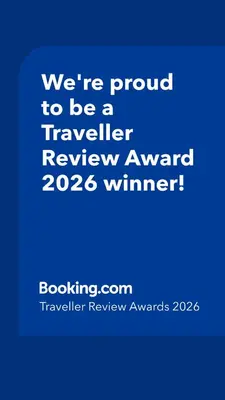 a blue sign that says were proud to be a traveller reviewagency winner at 2 Bed Apartment Free Parking Central Location in Vancouver