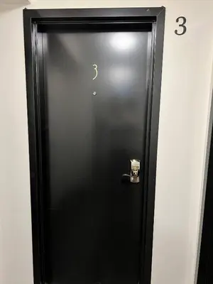 a black door with a question mark on it at Dt 1Bed 1bath Cozy Suite 8 Min Walk To Arena in Edmonton