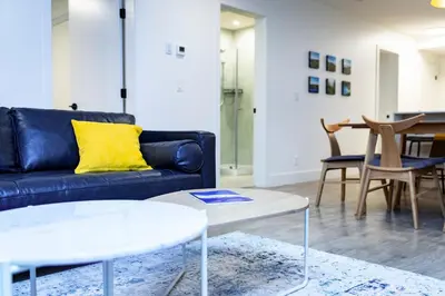 a living room with a couch and a table at Separate Reality Retreat by Revelstoke Vacations in Revelstoke