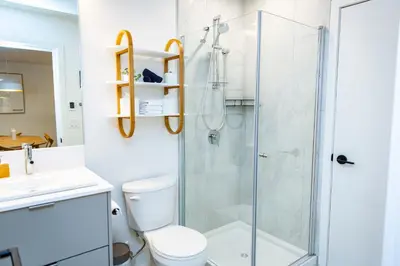 a bathroom with a shower and a toilet at Separate Reality Retreat by Revelstoke Vacations in Revelstoke