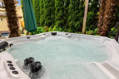 a jacuzzi bathtub with two balls in it at Luxury Retreat in Vancouver in Vancouver