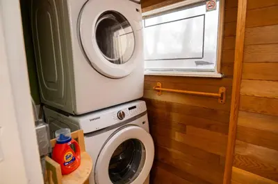 a washing machine and a dryer in a bathroom at 3 Bedroom Gardenside Downtown Home in Whitehorse