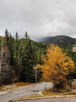 an empty road in the middle of a mountain at Cozy apartment in the heart of Panorama in Panorama