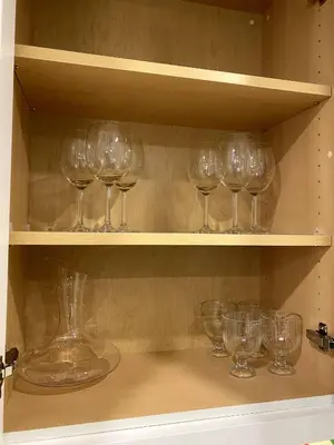a bunch of wine glasses sitting on a shelf at Luxury unit in the heart of Canmore in Canmore