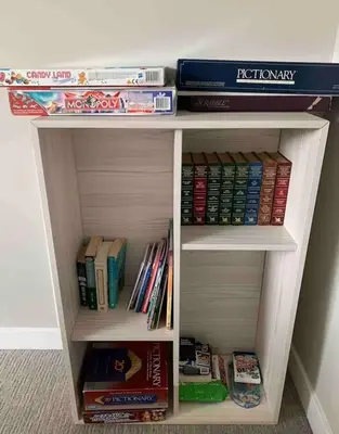 a book shelf filled with lots of books at New Townhouse in Red Deer in Red Deer