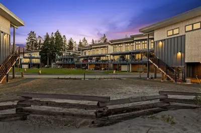 a group of buildings in a park at dusk at Ocean View Townhouse #26 at THE BEACH HOUSE in Campbell River