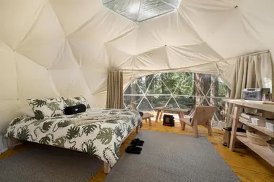 a room with a bed in a tent at Stay Wilder Sunshine Coast in Sechelt