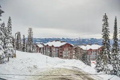 a resort in the snow with snow covered trees at Ponderosa Inn by Okanagan Premier in Big White