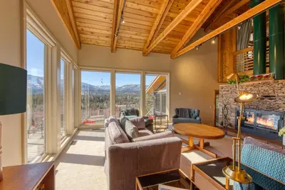 a living room filled with furniture and a fireplace at CLIFF CABIN Family Friendly|Hot Tub|Spectacular Views in Fairmont Hot Springs