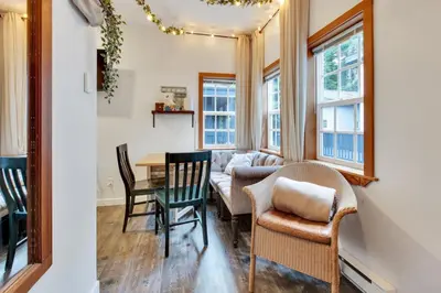 a living room with a table and chairs and a couch at Grey Whale, Pet Friendly Studio at The Beach in Ucluelet
