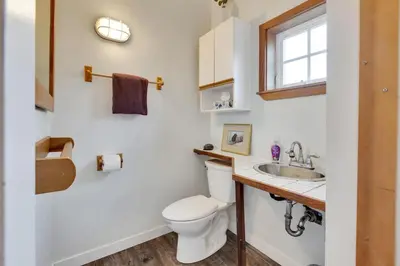 a bathroom with a toilet and a sink at Grey Whale, Pet Friendly Studio at The Beach in Ucluelet