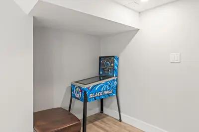 a room with a soda machine and a stool at Stunning Heritage Home, Sleep 8, Hot Tub, Private Yard, Firepit in Vernon