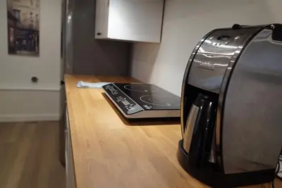 a coffee maker sitting on a counter in a kitchen at Private Suite Steps to Main St. in Vancouver