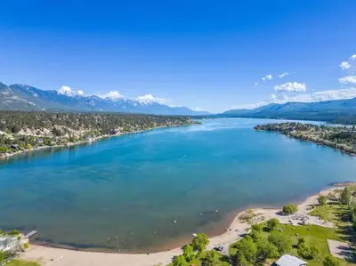 an aerial view of a river with a beach at Lakeside Memories, Pool, Hot Tub, Central in Invermere