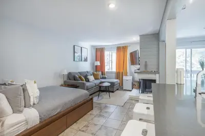 a living room with a bed and a couch at Whistler Studio by Gondola & Free Parking in Whistler