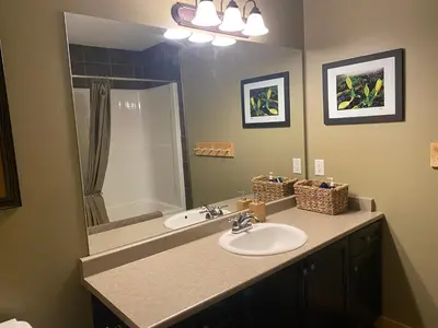 a bathroom with a sink and a shower at Morrisey Chalet at Sun Peaks in Sun Peaks