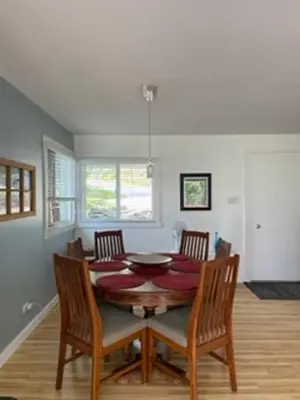 a dining room with a table and chairs at Sweet Creek Retreat in Nelson