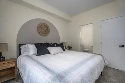 a bedroom with a large white bed with pillows at Black Diamond Cabin - Sasquatch Mountain Resort in Agassiz