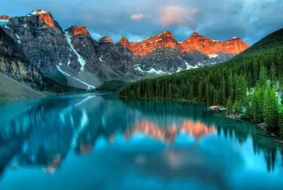 a view of a lake with mountains in the background at The Mountain Loft in Canmore