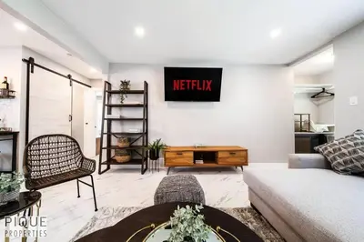 a living room with a couch and a table at Park Life Retreat - King Bed - Pet Friendly - Sleeps 6 in Edmonton