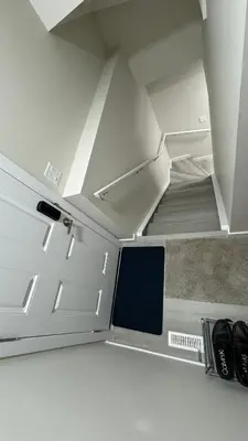 a staircase in a room with a white ceiling at Brand new 2 Bedrooms modern guest suite with separate entrance in Calgary