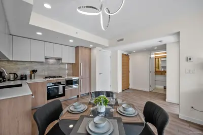 a kitchen and dining room with a table and chairs at Stylish and Tranquil Retreat in Richmond City Center in Richmond