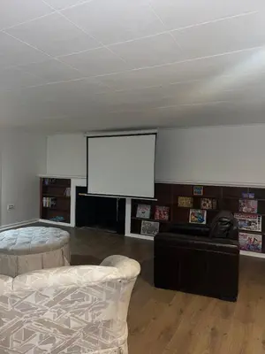 a living room with a flat screen tv and a couch at Home in West Vancouver in West Vancouver
