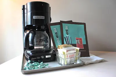 a coffee maker sitting on top of a counter at Quarterdeck Inn Port Hardy in Port Hardy