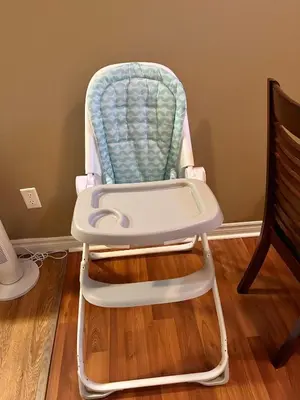 a baby high chair sitting in a room at Spacious 2BR Near HWY 1-Heritage Park - Cultus Lake -Fishing! in Chilliwack