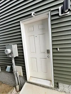 a white door on the side of a house at Stylish Retreat with King Bed, Long Stays, WEM, Disney+ in Edmonton