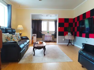 a living room with a couch and a coffee table at Cozy Red Deer Suite for 3 in Red Deer
