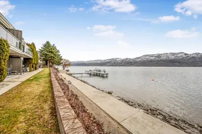 a view of a lake with mountains in the background at Secluded Cabin On The Lake #7 in West Kelowna