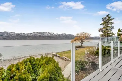 a view of the water from the deck of a house at Lakeside Serenity Retreat #10 in West Kelowna