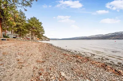 a rocky shore of a body of water at The Perfect Getaway Cabin in the Okanagan #6 in West Kelowna