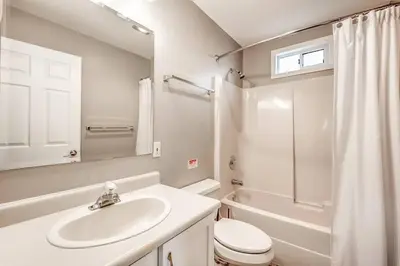 a bathroom with a sink and a toilet and a shower at The Perfect Getaway Cabin in the Okanagan #6 in West Kelowna