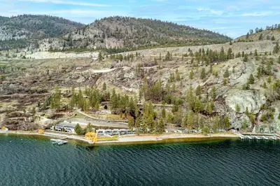 an aerial view of an island in a body of water at Cozy Cottage by the Lakeshore #4 in West Kelowna