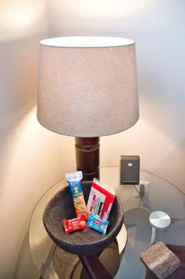 a lamp sitting on top of a table next to a lamp at YEG Chic Luxury Accommodation in Edmonton