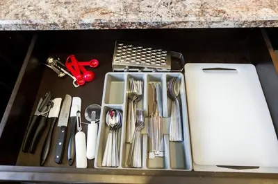 a drawer filled with kitchen utensils on a counter at Modern Home - King Bed - Garage - Long Stays in Edmonton