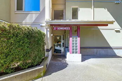 a building with a sign that reads surfaces at Harbour Retreat in Victoria