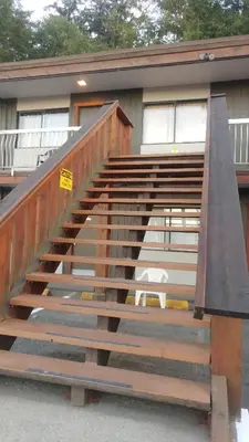 a set of stairs in front of a house at Big Rock Motel in Campbell River