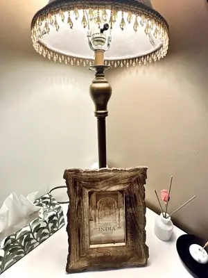 a lamp on top of a table with a picture at Scorpio House Langley -ROOM 1 Separate restroom in Pitt Meadows