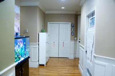 a hallway with a refrigerator and a fish tank at Scorpio House Langley -ROOM 1 Separate restroom in Pitt Meadows
