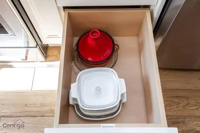 a box with a red pot and plates in it at Stylish Euro Vibes Home, Small Gym, AC, Yard, Office in Edmonton