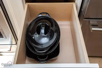 a black appliance in a drawer of a refrigerator at Stylish Euro Vibes Home, Small Gym, AC, Yard, Office in Edmonton