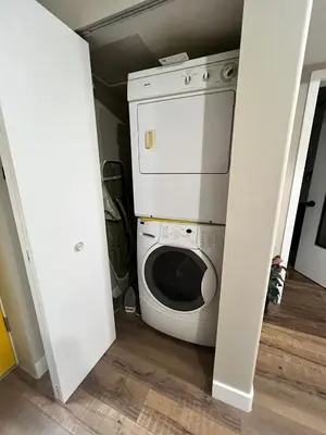 a washer and dryer in a small room at Yellow Door Suite in Campbell River