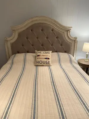 a bed with a sign that reads the take a house at Blue Shore Resort in Savona