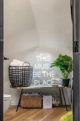 a sign that says this must be the place in a bathroom at Dome House YYC, Iconic, Luxury, Backyard Oasis in Calgary