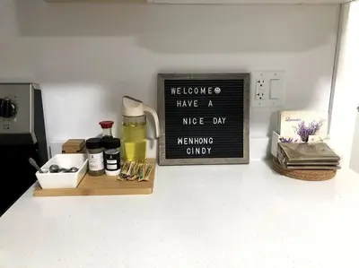 a kitchen counter with a sign that says we have a nice day at Gorgeous 2 Bedrooms Suite Private entrance with patio-Free Parking in Maple Ridge District Municipality