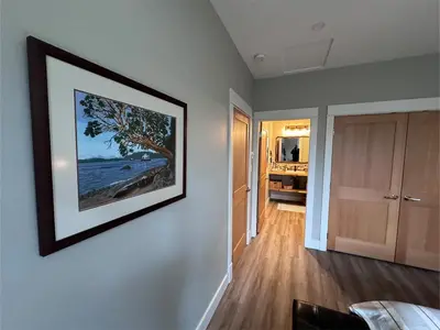 a living room with a picture on the wall at Cowichan Valley Guest Cottage in Ladysmith